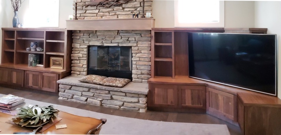 Custom wooden cabinets around fireplace